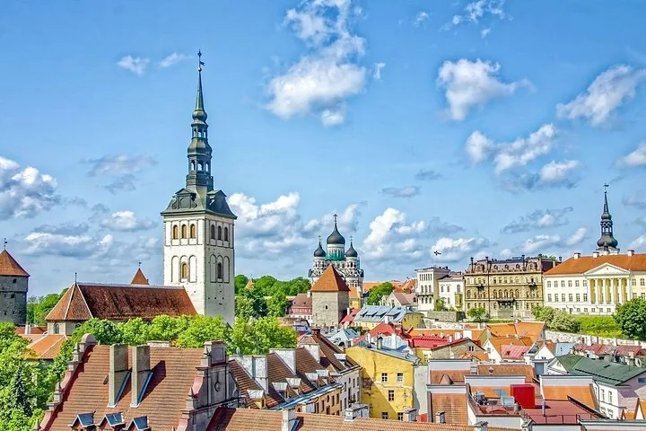 Cityscape of Tallinn showing various historic buildings and church towers.