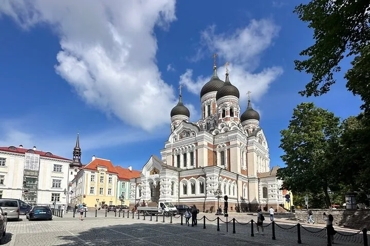Alexander Nevsky Cathedral standing in a city square on a sunny day.